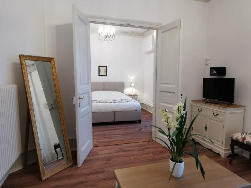Postel nebo postele na pokoji v ubytování Colmar Suites - Résidence