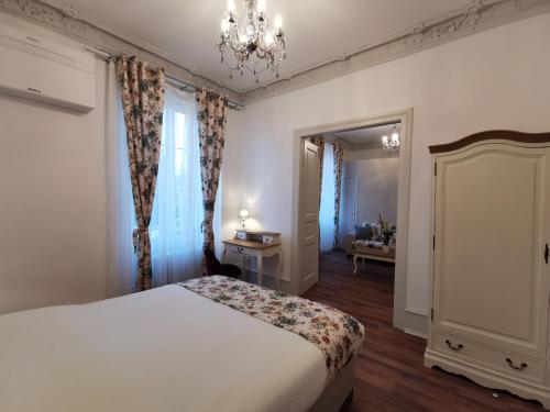 Postel nebo postele na pokoji v ubytování Colmar Suites - Résidence