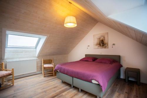 Una cama o camas en una habitación de Vakantiehuis Brickx