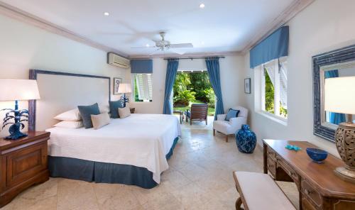 a bedroom with a bed and a living room at Seventh Heaven by Island Villas in Saint James
