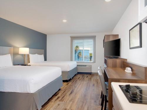 Ένα ή περισσότερα κρεβάτια σε δωμάτιο στο Extended Stay America Select Suites - Melbourne - West Melbourne