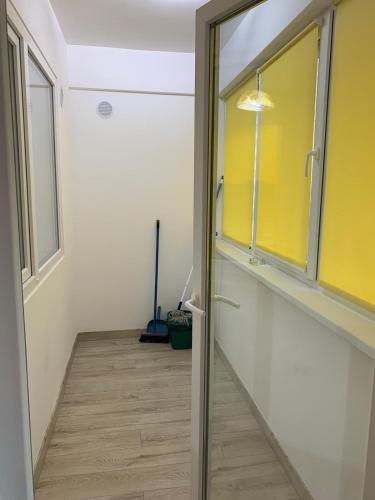 a hallway with a sliding glass door in a room at Luxury Apartments Newton by GLAM in Iaşi