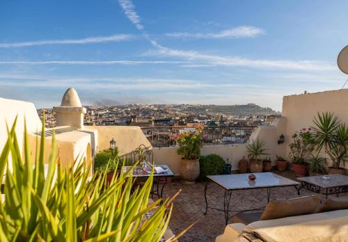 a balcony with a view of a city at Le Cèdre D'argent in Fès