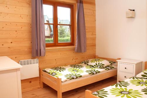 Postel nebo postele na pokoji v ubytování 4 Domki