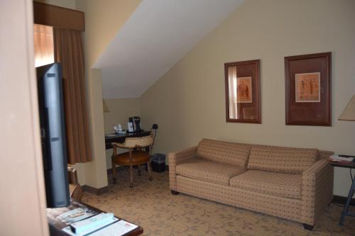 a living room with a couch and a table at Hyatt Place Springdale - Zion National Park in Springdale