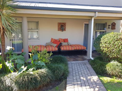 a couch on the front porch of a house at Bethel B&B / Selfcatering in George
