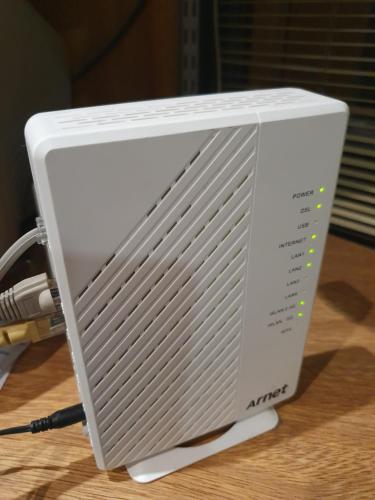 a white computer monitor sitting on a table at Departamento Céntrico in Rosario