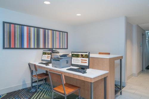 an office with two computers on a desk at Holiday Inn Express Radcliff Fort Knox by IHG in Radcliff