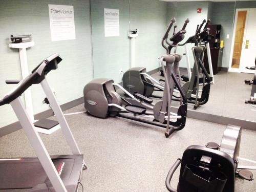 a gym with several treadmills and elliptical machines at Holiday Inn Express Hotels Biddeford by IHG in Biddeford