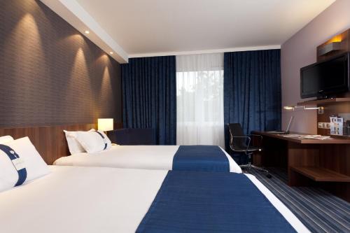 Un ou plusieurs lits dans un hébergement de l'établissement Holiday Inn Express Strasbourg - Sud by IHG