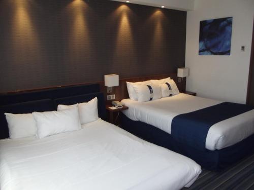 Un ou plusieurs lits dans un hébergement de l'établissement Holiday Inn Express Strasbourg - Sud by IHG