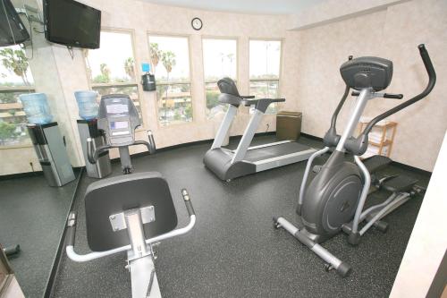 a gym with three exercise bikes and a treadmill at Holiday Inn Express San Diego South - Chula Vista by IHG in Chula Vista