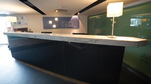 a long counter in a room with a light on it at Holiday Inn Express Toluca Galerias Metepec by IHG in Toluca