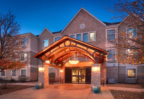 a home with an archway in front of a building at Staybridge Suites Peoria Downtown by IHG in Peoria