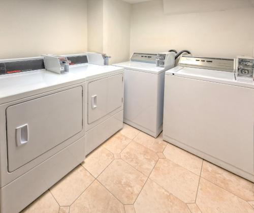 a kitchen with a sink and a refrigerator at Holiday Inn Hotel Port of Miami-Downtown, an IHG Hotel in Miami