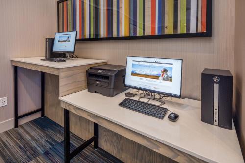 a desk with a computer and a monitor on it at Holiday Inn Express - Sunnyvale - Silicon Valley by IHG in Sunnyvale