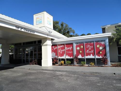 a store front with graphics on the windows of it at Smart Stay Inn - Saint Augustine in Saint Augustine