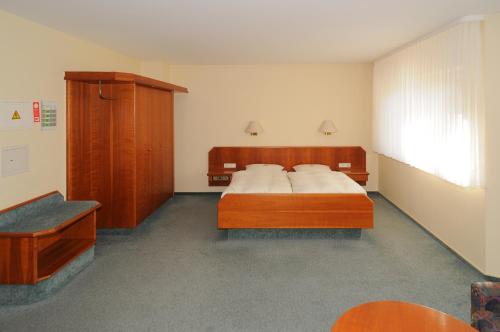Ένα ή περισσότερα κρεβάτια σε δωμάτιο στο Alfa Apartment Hotel