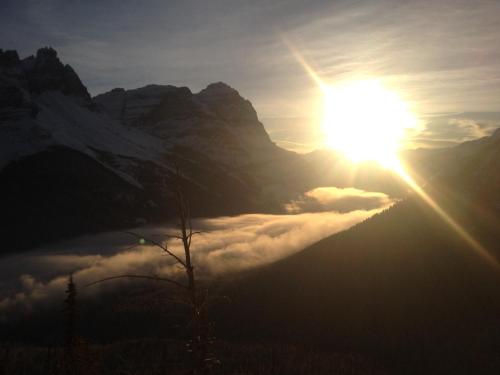 a view of the sun rising over a mountain at Canadian Rockies Inn - Adults only in Field