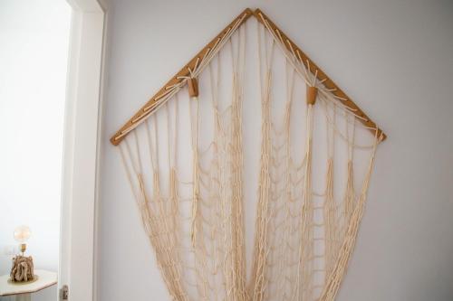 a curtain hanging on a wall in a room at Vistas al Mar junto a la playa 3B in Poris de Abona