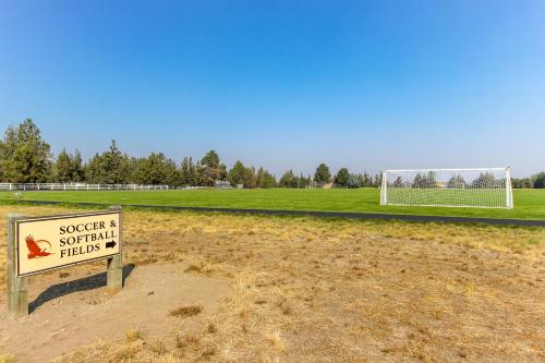 a sign in front of a soccer field with a goal at Eagle Crest Nature Retreat in Redmond