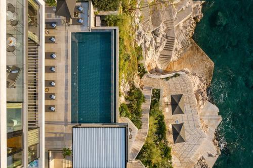 an aerial view of a building next to the ocean at Villa Amelie - Private Seaside Haven in Dubrovnik