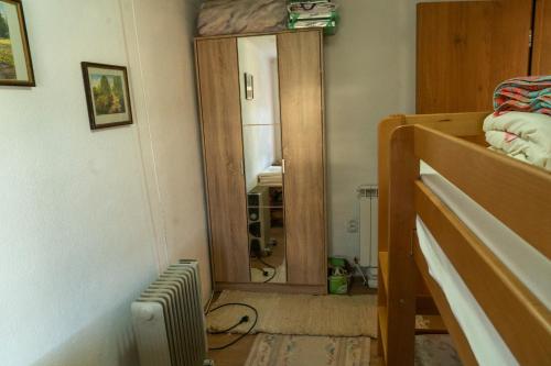 a bedroom with a mirror and a bunk bed at Grandpa's House in Plav