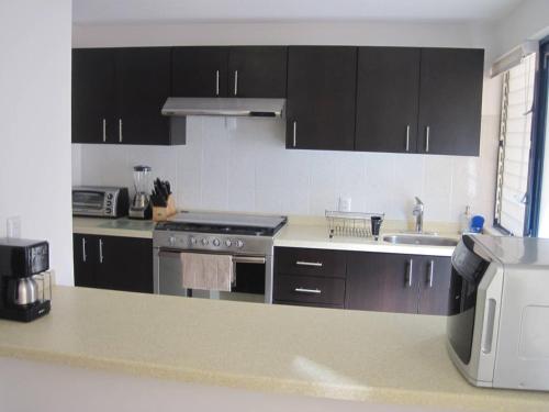 Η κουζίνα ή μικρή κουζίνα στο Linda y Acogedora Suite Áreas verdes Alberca Zona Norte 27B