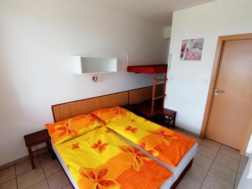 Postel nebo postele na pokoji v ubytování Penzion Nad jezerem