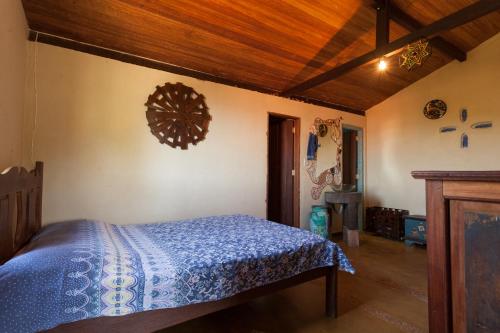 Ένα ή περισσότερα κρεβάτια σε δωμάτιο στο Casa Aconchego do Sol 5 minutos do centro