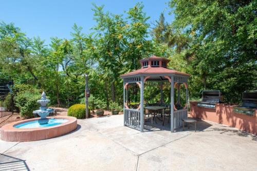 a gazebo with a fountain in a park at Bell Rock Inn in Sedona
