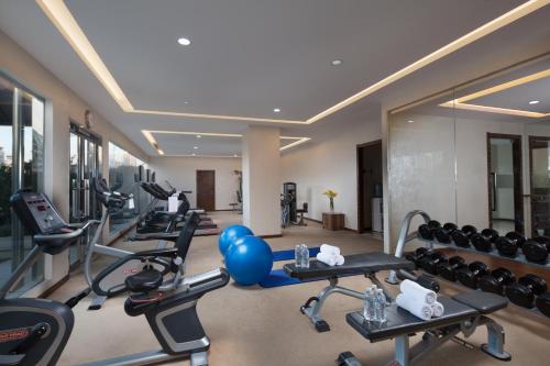 a gym with a bunch of exercise bikes and balloons at Jin Jiang Tower in Shanghai