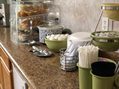 a kitchen counter with eggs and bowls and utensils at Platte Valley Inn in Columbus