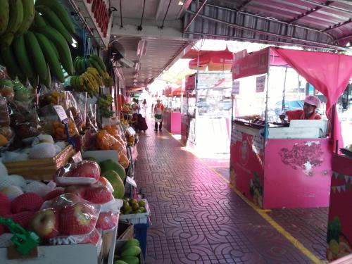 a market with a bunch of fruits and vegetables at Pingplalee Female House in Bangkok