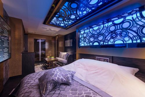 Un pat sau paturi într-o cameră la HOTEL W-AVANZA-W GROUP HOTELS and RESORTS-