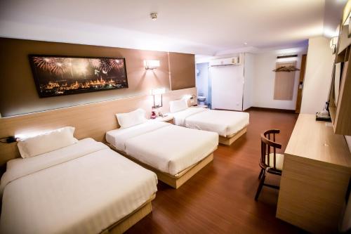 Krevet ili kreveti u jedinici u objektu Chiang Roi 7 Days Inn