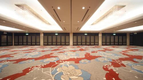 a large room with a large painting on the floor at Aki Grand Hotel & Spa in Miyajima
