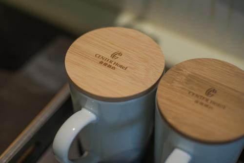 two wooden seats on top of a coffee mug at Center Hotel Xi'an Bell Tower in Xi'an