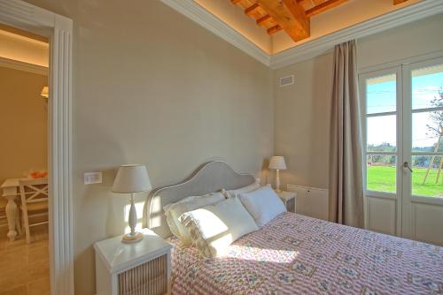Säng eller sängar i ett rum på Il Sole di Vino by PosarelliVillas
