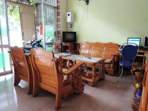 a room with chairs and a table and a tv at Hien Luong Hotel in Nha Trang