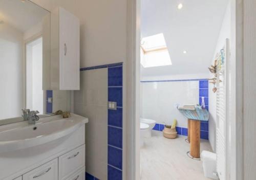 a bathroom with a white sink and a toilet at A Carubba du Bungiurnu in Borgio Verezzi