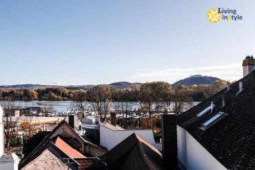 a view of a river from the roofs of houses at Living inStein in Krems an der Donau