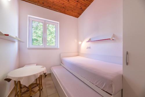 Posteľ alebo postele v izbe v ubytovaní Apartment Alan