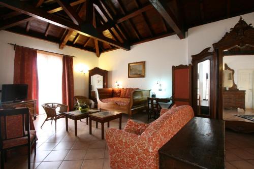 a living room with a couch and a table at Hotel Villa Sonia in Taormina