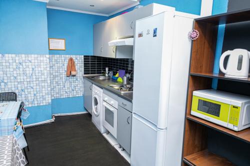 A kitchen or kitchenette at Economy Hotel iProspali on Kurskaya