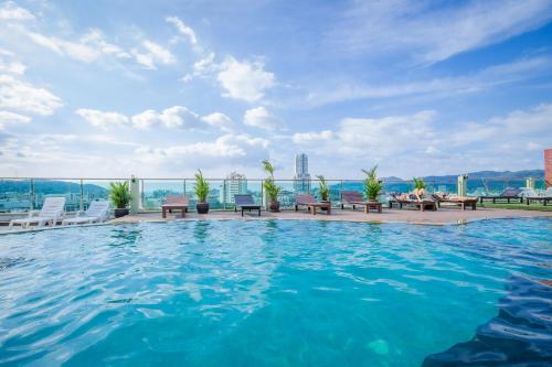 a swimming pool on the roof of a building at Add Plus Hotel & SPA in Patong Beach
