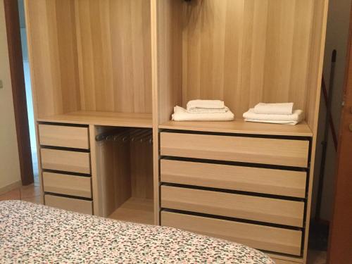 a bedroom with a closet with two towels at Il ponticello in Ortona