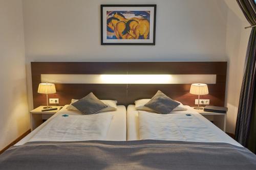 Hotel im Kornspeicher tesisinde bir odada yatak veya yataklar