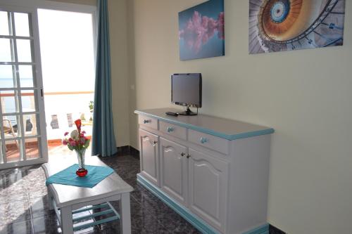 TV o dispositivi per l'intrattenimento presso Apartamentos Casa Junonia