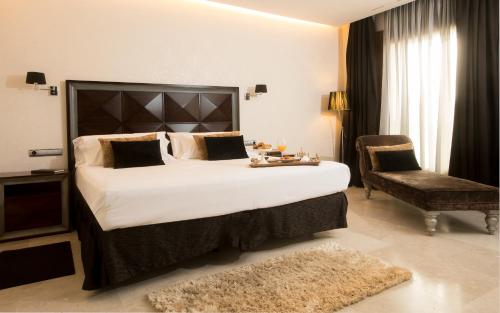 Säng eller sängar i ett rum på Hotel & Spa Arzuaga